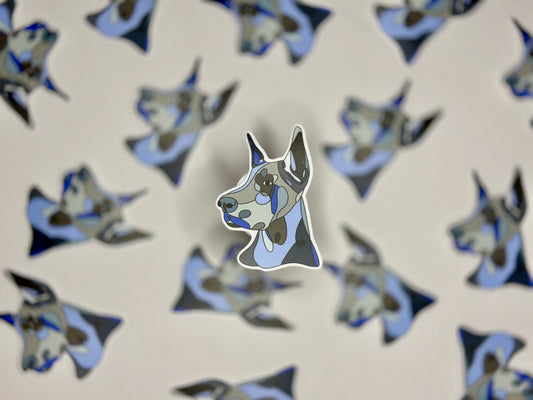 A sticker of a blue and white Doberman pinscher head in a pattern of the same image.