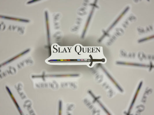 Sticker with 'Slay Queen' text and sword graphic on a blurred background of similar stickers.